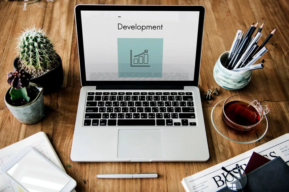 laptop displaying the text development jpg.webp